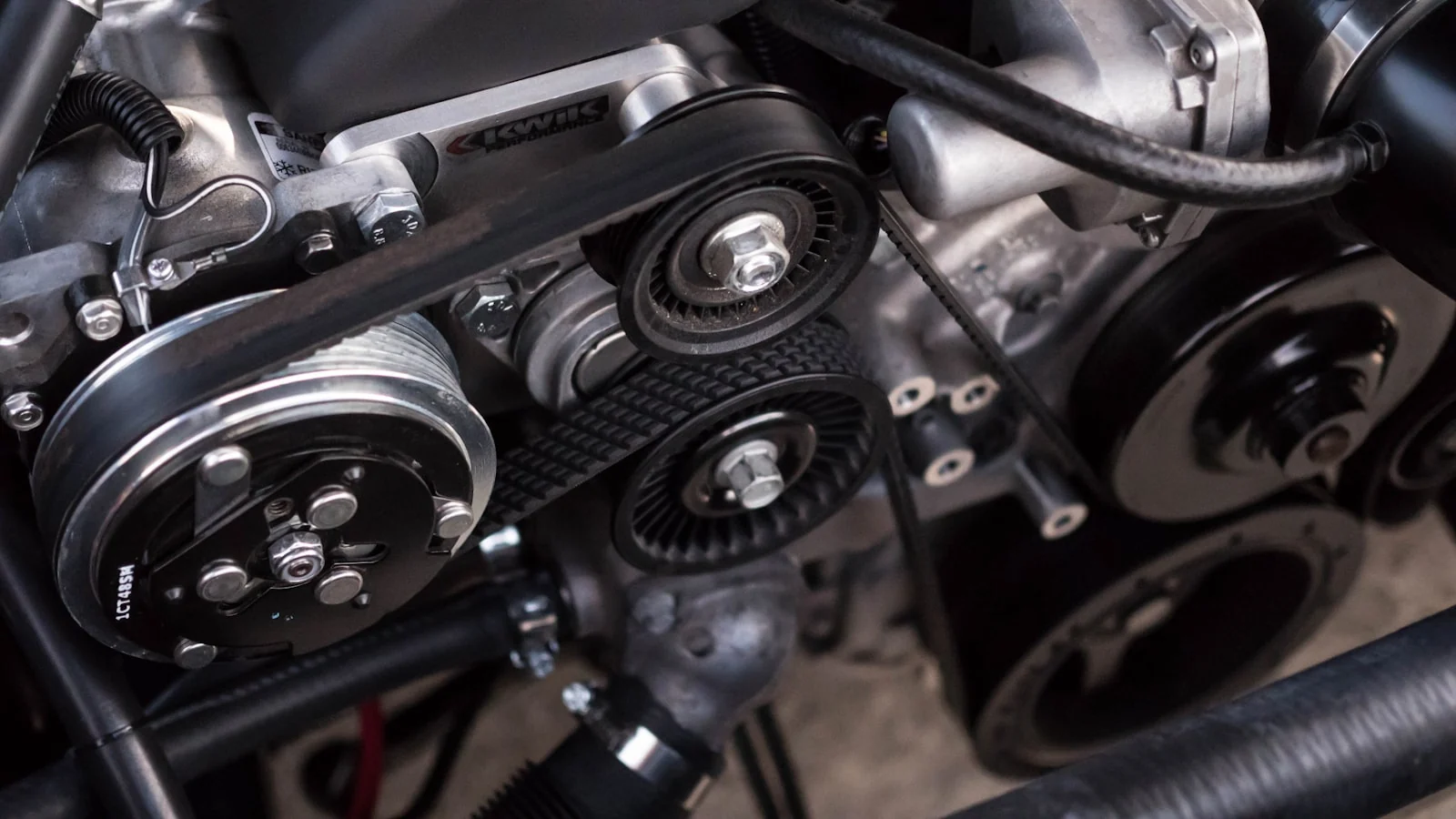 Close view of vehicle engine components representing a recall repair at a service facility
