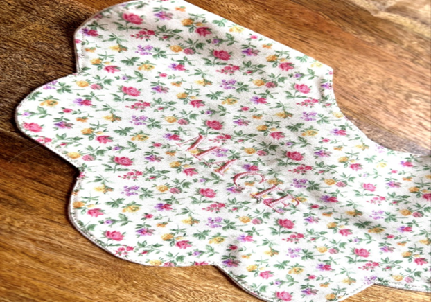 Recalled bib with floral print