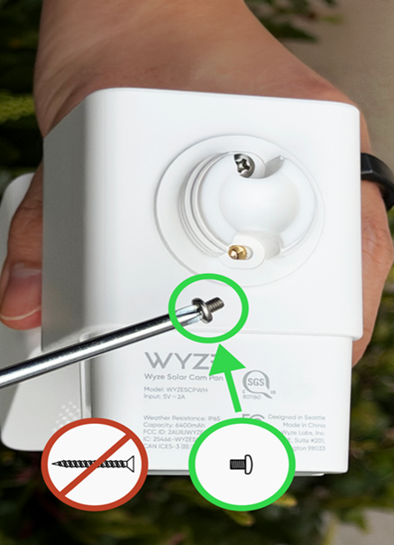 The short pan-head screws should be used to attach the solar panel to the camera. The long flat-head screws are for mounting the unit to the side of a hous