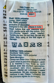 The sewn in label with the batch code and 