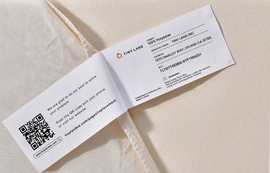 The Tiny Land logo and batch number TLTGTT003BG-XYF1506251 are printed on a label stitched on inside of the recalled play tent